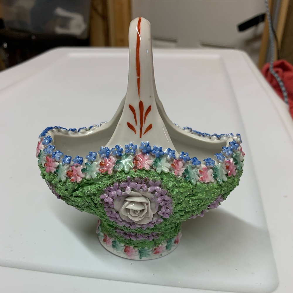 Elfinware basket
with lush green moss and vibrant pink, purple and blue flowers